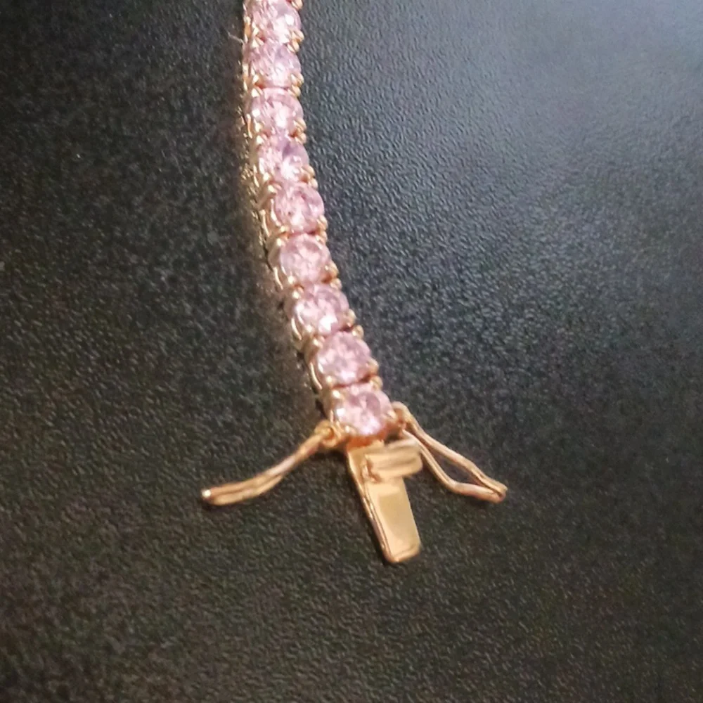 Elegant Gold Tone Bracelet with Pink Stones